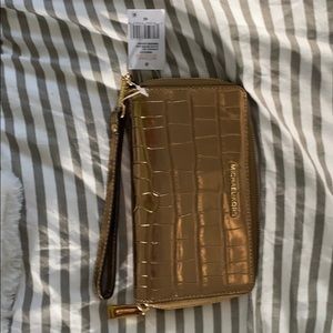 Michael Kors gold clutch.